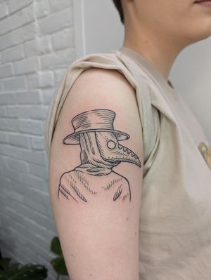 Detailed blackwork tattoo of a plague doctor in fine lines by artist Sara Jensen.