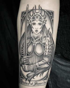 A striking black and gray illustrative tattoo of the Queen of Swords card, expertly done by Amandine Canata.