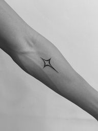 Minimalist Starburst Tattoo