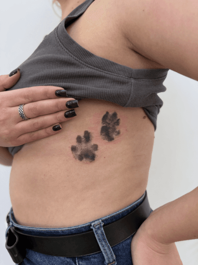 Tattoo of my client’s beloved cats’ paw prints. They were done in their natural size #microrealism