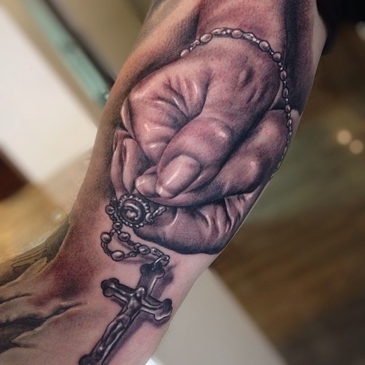 praying hands with cross and rosary tattoo