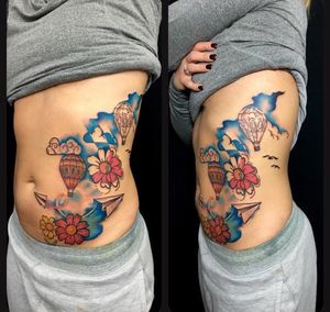 Get inked by Sandro Secchin with a stunning new school design combining a flower and a balloon on your ribs.