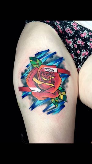 Vibrant new school flower tattoo on upper leg, expertly executed by renowned artist Sandro Secchin.