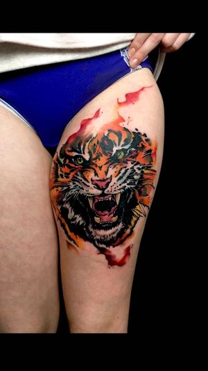 Immerse yourself in the fierce beauty of a new school watercolor tiger tattoo by the talented artist Sandro Secchin.