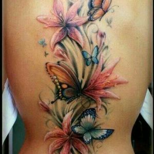Beautiful flow and color. Soft and realistic full back tattoo. #floral #butterfly #fullback #feminine