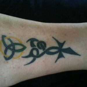 My sister designed this and we both have this tattoo on the leg same area..got this done 2008