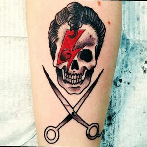 My first tattoo I got while in hairstyling school in 2013. Features the shears and a Bowie bolt for extra inspiration. #Hairstylist #Bowie #skulltattoo #tattoo #scissors #lightning