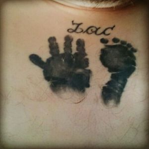A piece I had done in memory of my son Zac who passed away aged 4 months.Because he was born with only 4 digits on his hand it makes a very unique piece.
