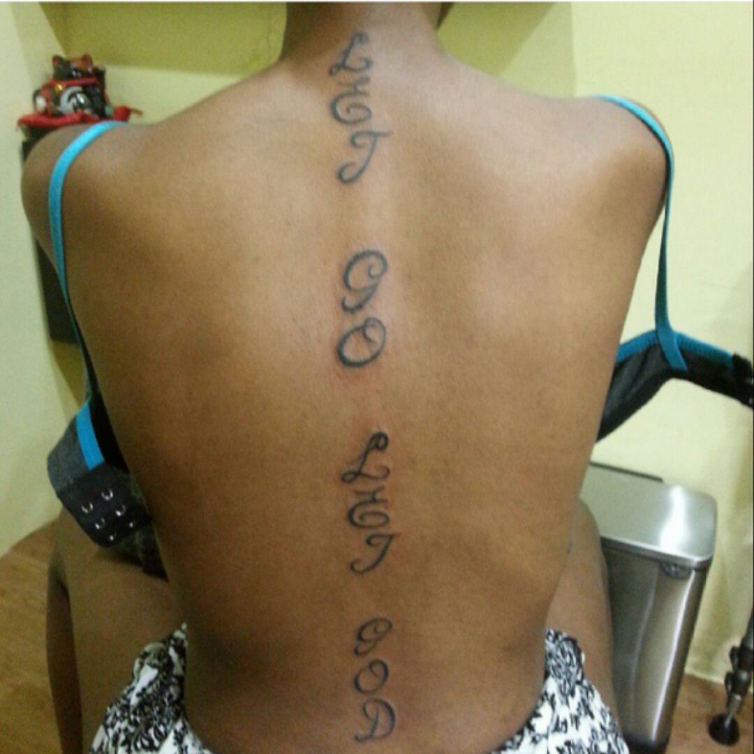 Lettering tattoo that says let go and let god done on