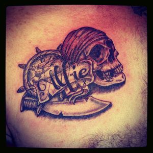 #pirateskull tattoo that I designed and tattooed for someone at work with the name of their grandson put in #pirate #helm #piratemap #map #name #blackandgrey #chesttattoo