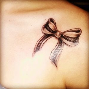 Ribbon tattoo. No simple meanings here. It's as complicated as a knott . #ribbon #ribbontattoo #bff #lace  #shoulder