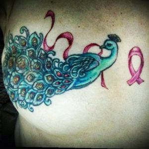 Half of the mastectomy scars tattoo. The other half is a mirror image of the peacock. Outlines done 4 years ago at Love Hate Tattoo in Rochester, NY. Color done in 2015 by Steve Shales at Lucky Lotus, Rochester, NY. #peacock #breastcancer #mastectomytattoo