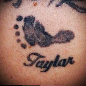 My oldest daughters name (Taylar) and footprint from her crib card. #footprints #babies #babygirl #tattooedmommy