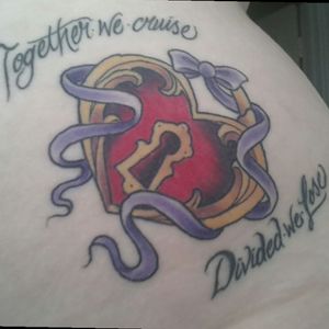 This is on my left hip... my husband has a key around his wrist and the same writing on his chest.