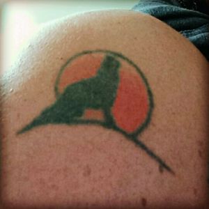My very first tat...a silhouette of a wolf in front of a harvest moon. Got it in a tattoo shop in Kaila, HI in 1995