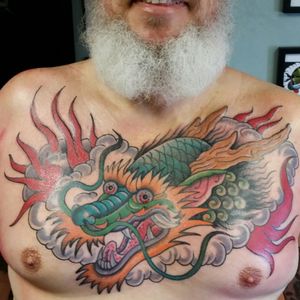Dragon by Dennis Clements II #traditionaltattoo #tattooedman #inked #inkedforlife #dragontattoo #tattoocommunity #tattoocollector #chestpiece
