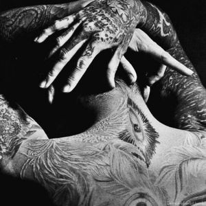 Kyo the vocalist from Dir en Grey has some amazing ink on him! the artist/artists are unknown tho ....
