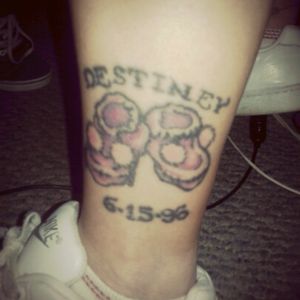 My first born daughter's name in hand nitted baby booties I got this done at trader bobs in stl MO Jefferson