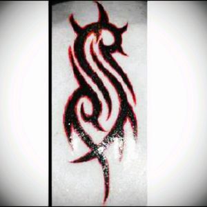 My first tat! Back when I was 20; the Slipknot S...