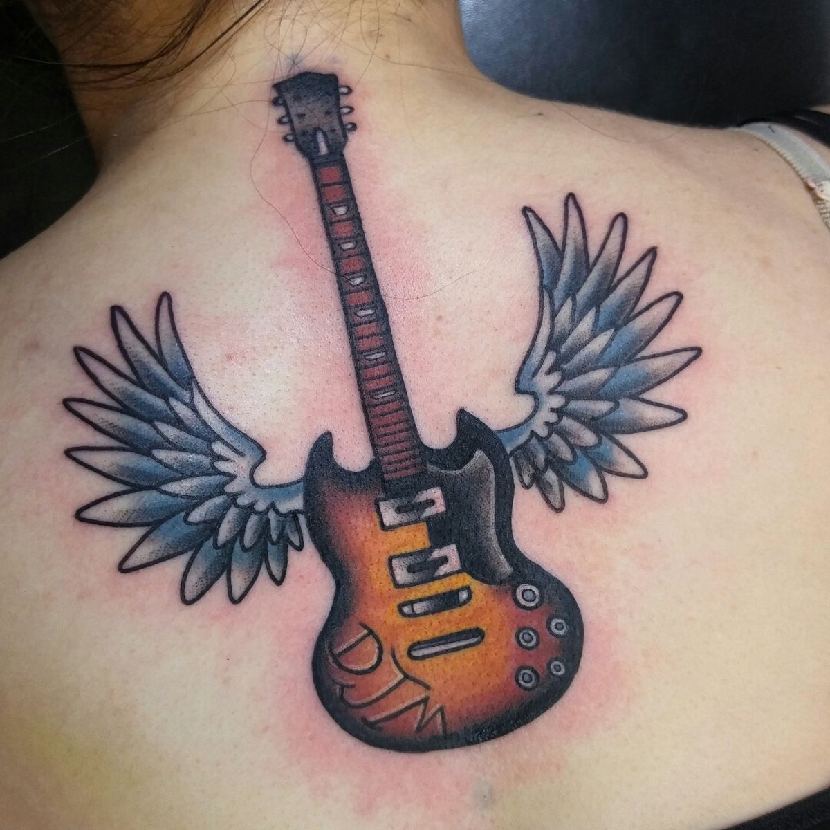 Tattoo uploaded by Christopher Dolsen • One from a couple months back # guitar #wings #traditional • Tattoodo