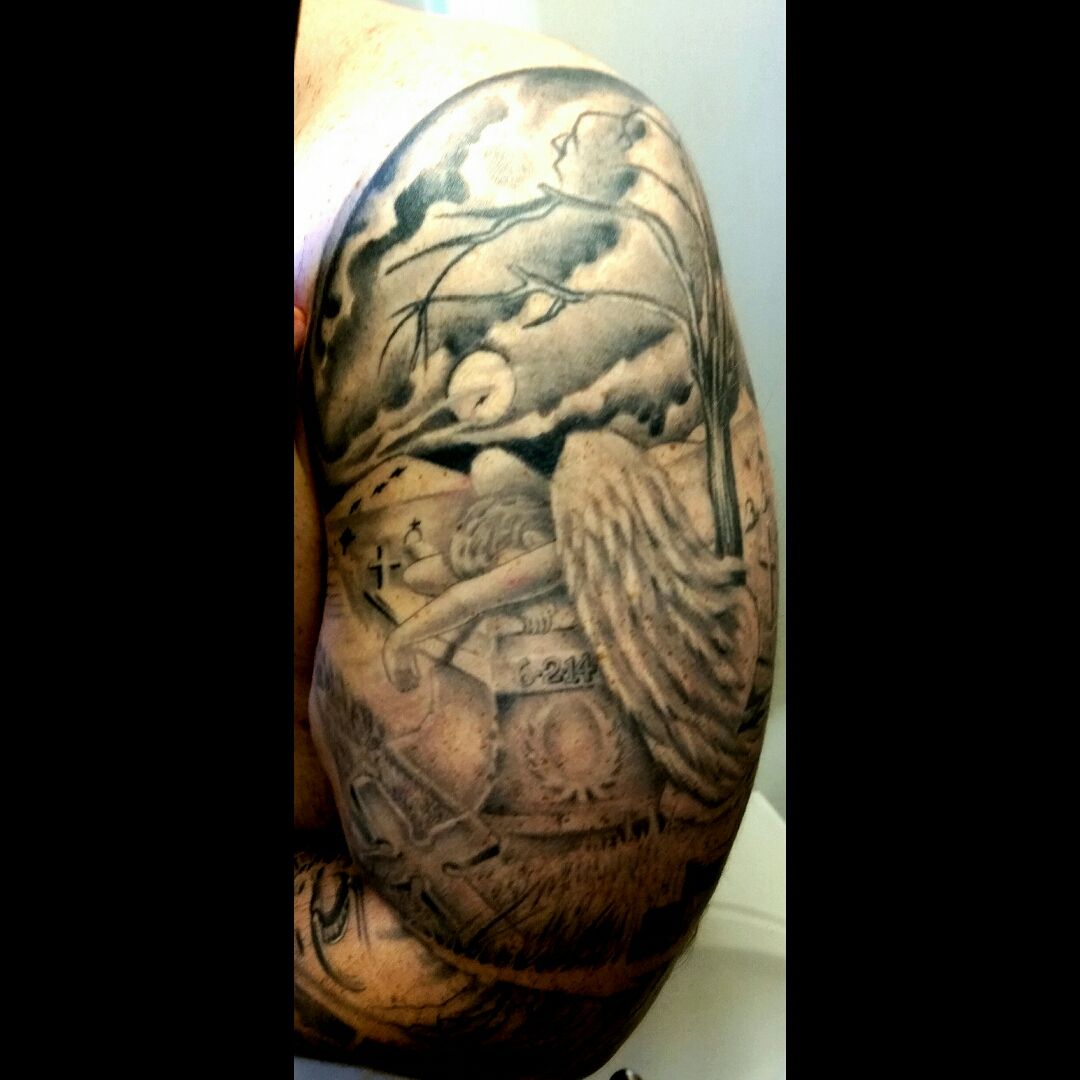 angel crying on tombstone tattoo