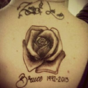 my two other tattoos. my girls names on my neck and a rose for my father