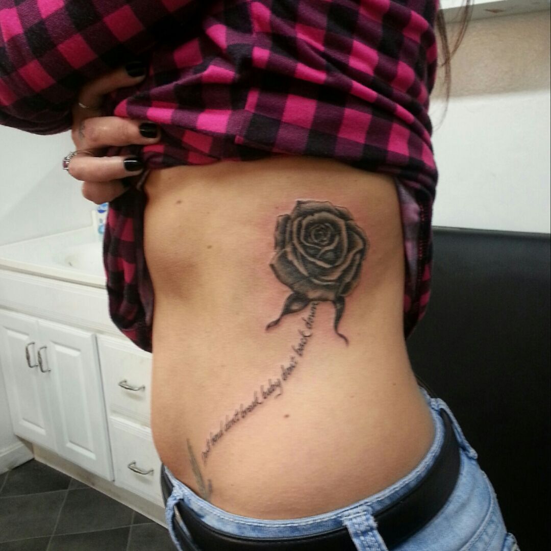 Tattoo uploaded by Agela • Bon Jovi lyrics and rose left side • Tattoodo