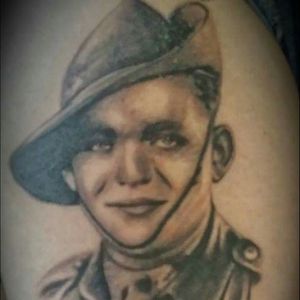 This is one of my most favorite tattoos that I have, it's a portrait of my Grandfather in uniform from WWII. LEST WE FORGET! Please excuse my bad photography, it doesn't do the portrait any justice.