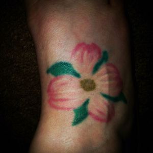 My third tattoo done in May 2010. I flew to North Carolina to meet an (ex) boyfriends family and wanted something to remember the trip by. This is a dogwood, the state flower. I didn't really think this one thru as I got it done the day before I had to fly back to Oregon. My foot was swollen beyond belief!