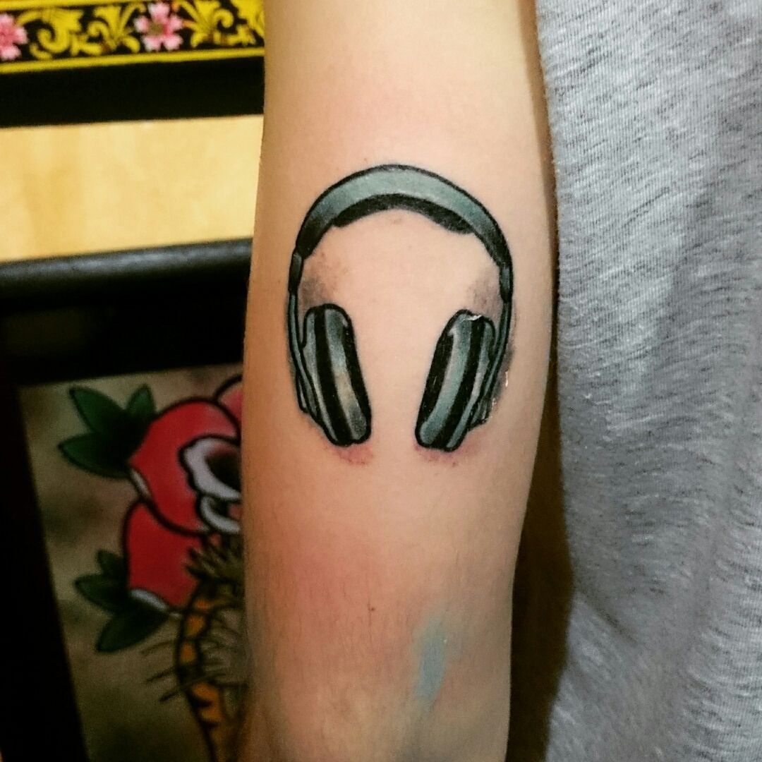Headphones tattoo meanings & popular questions