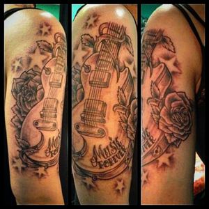 Guitar action...tattoo by Josh