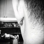 Minimalist simple circle earlobe tattoo