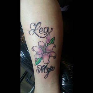 My wife's first tattoo. Our granddaughters names.