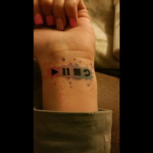 Simple water color wrist tattoo.