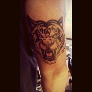 Tribal tiger with ca ding on triceps