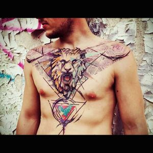 Pretty cool colorful lion chest tattoo