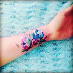 Pretty watercolour flowers tattoo