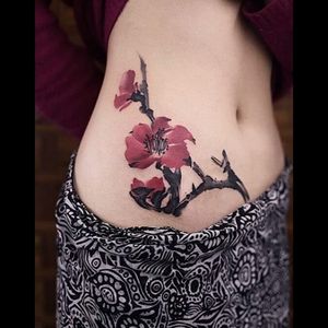 Sick red colored flower & branch tattoo#dreamtattoo #mydreamtattoo