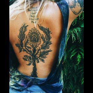 Cool black & grey flower, leaves & stem back piece & script tattoo