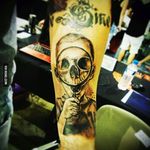 Sick black & grey child skull, magnify glad tattoo