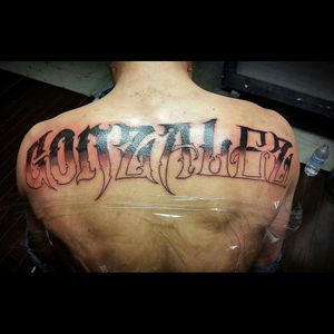 Got a good start to his last name go big or go home not bad for his first tattoo#script #backpiece #tattoome #firsttattoo