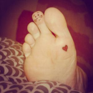 My toe man and little heart I did on myself. The man with the mustache has faded to look like a constellation Lol just a group of dots. But my heart is still doing well.. I didn't draw anything before to see what I was going to do, I just went with it. And this is what I got. #heart #foottattoo #ToeTattoo