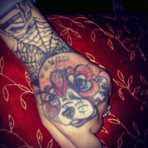 My husbands work had this for two years now and i still love it :) my red panda I helped design to make it more feminine to my husbands :)#handtattoo #redpanda#spiderweb#newschool