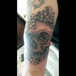 Skull with waves and flower skulls