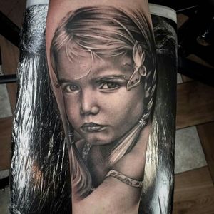 Beautiful child tattoo by Rob Richardson