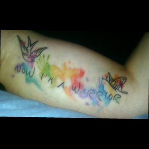 Now I'm a warrior tattoo with rainbow splash, a swallow and a butterfly. (by Jantina Sonnenschein, full-colour Bochum)