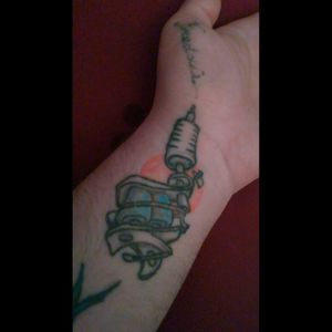 A tattoo gun tattooing my son's name on me. It needs to be touched up bad especially the name. #tattoo #handtattoo #bodyart