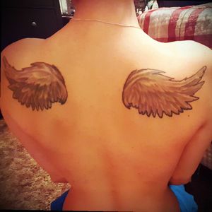 Wings. Hoping to get new and better wings tattooed over this mess.