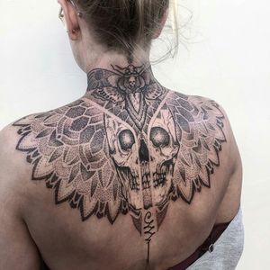 Cool black & grey large mandela & skull shoulder to shoulder, back of the neck tattoo