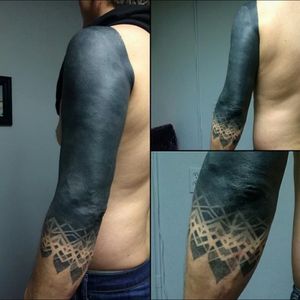 Wicked solid black work tattoo with delicate geometric end of this sleeve tattoo